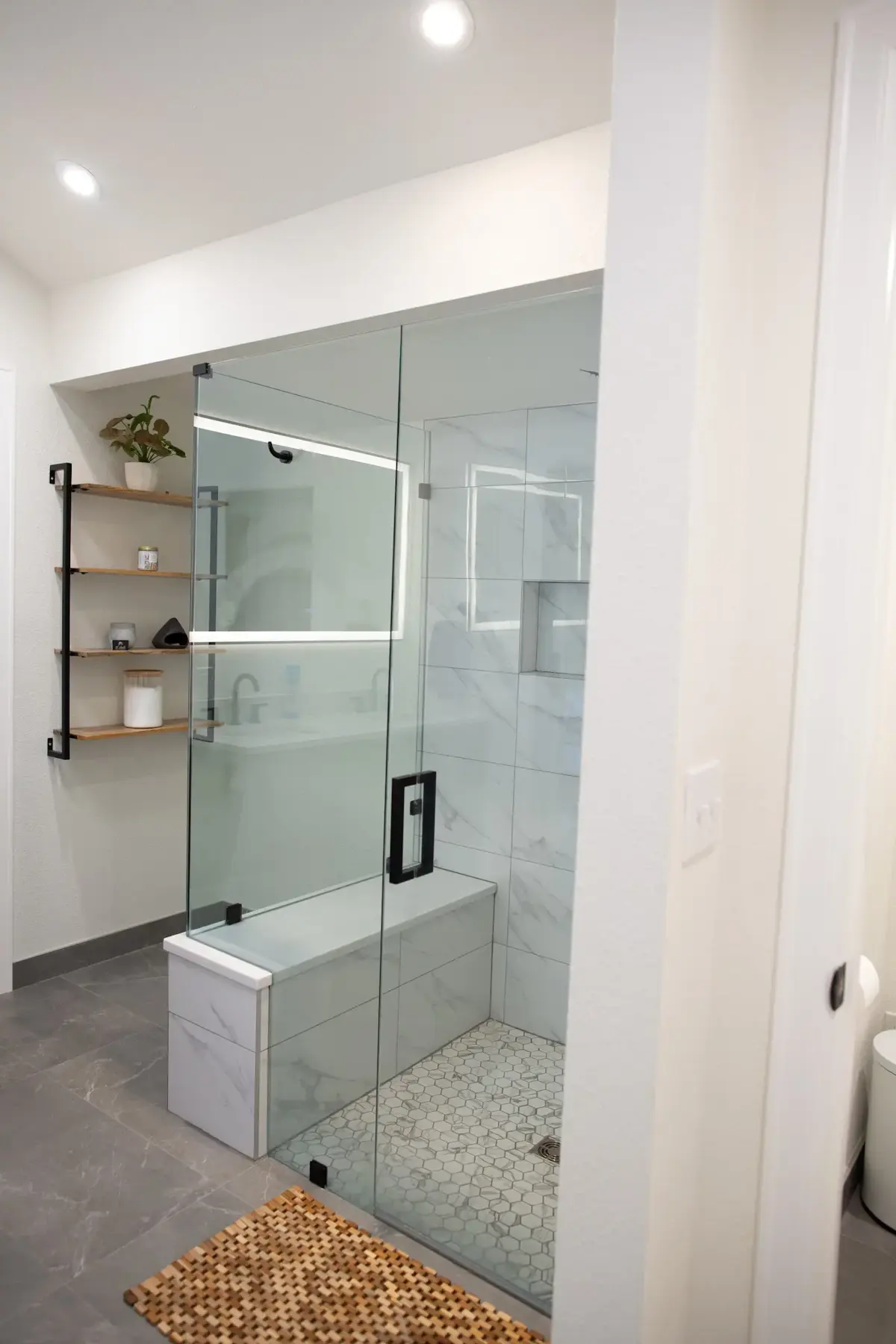 Arapahoe bathroom remodel with marble surfaces and a freestanding tub