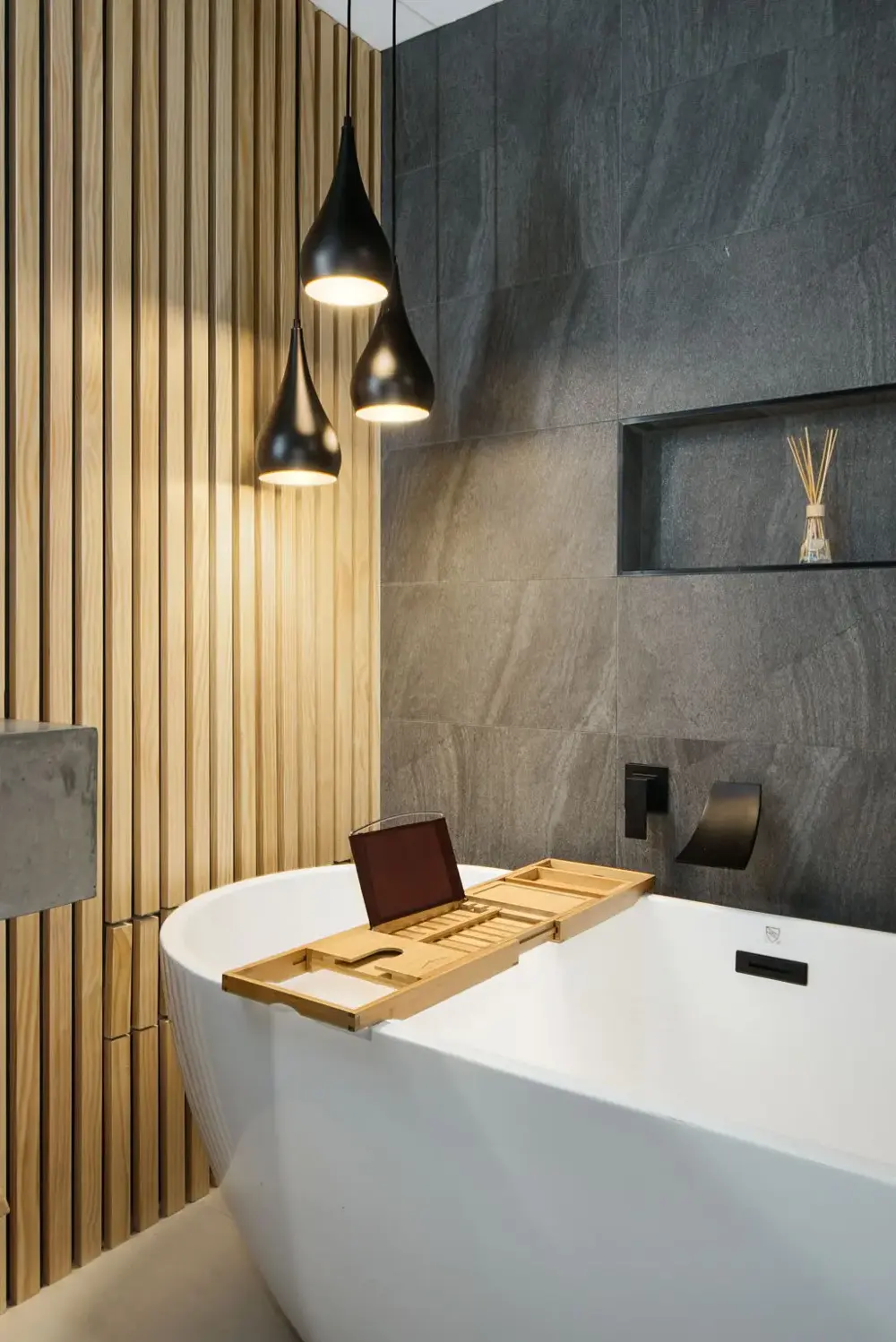 South Boulder spa bathroom remodel with a custom concrete sink and built-in wood shelf
