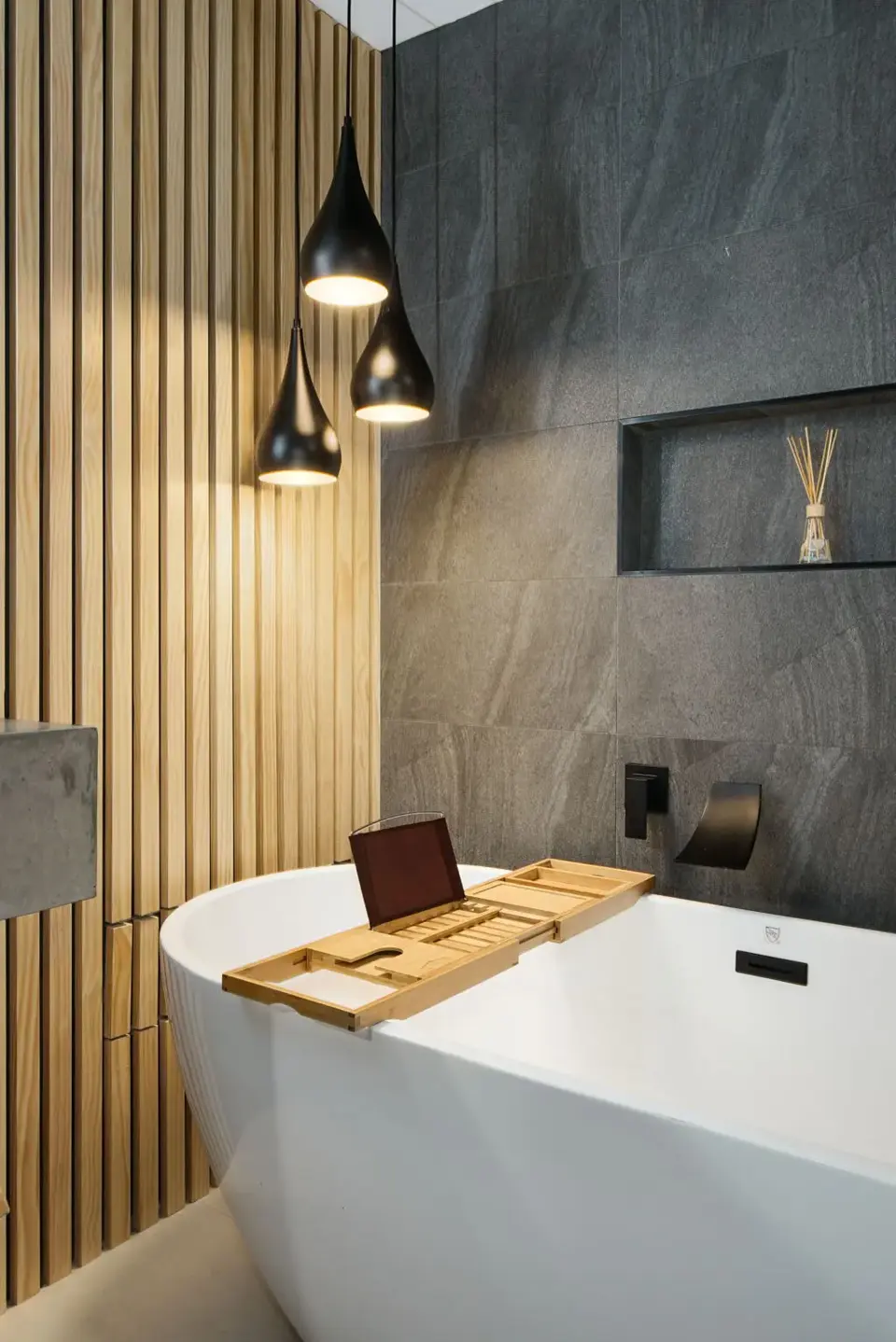 South Boulder spa bathroom remodel with a custom concrete sink and built-in wood shelf